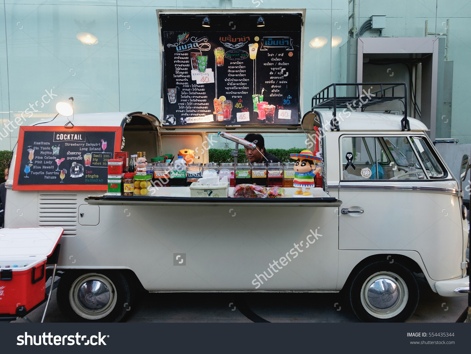 stock-photo-bangkok-thailand-january-food-trucks-parking-for-orders-by-customer-at-food-truck-554435344